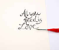 Handgemalter Spruch im Aquarellblumenkranz